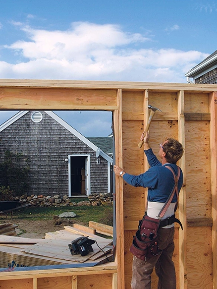 Construction Worker Framing Wooden Wall for Home Remodeling Fairfield CA