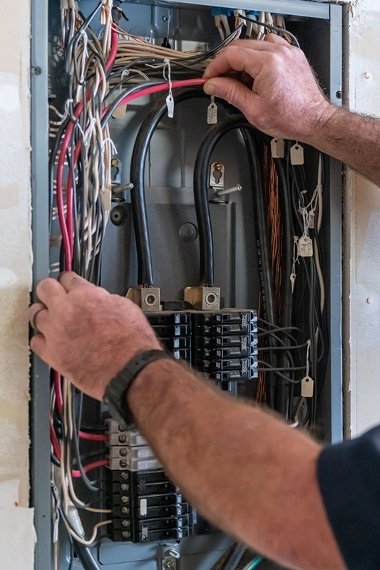 Technician Inspecting Electrical Panel Wires for Home Remodeling Fairfield CA
