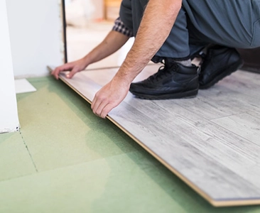 Worker Installing Laminate Flooring for Home Remodeling Fairfield CA