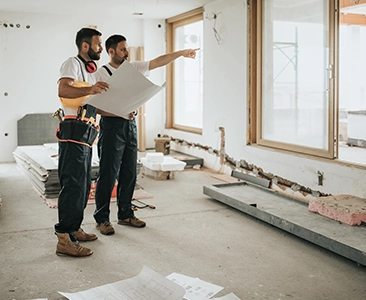 Two Workers Discussing Home Remodeling in an Unfinished Fairfield CA Room